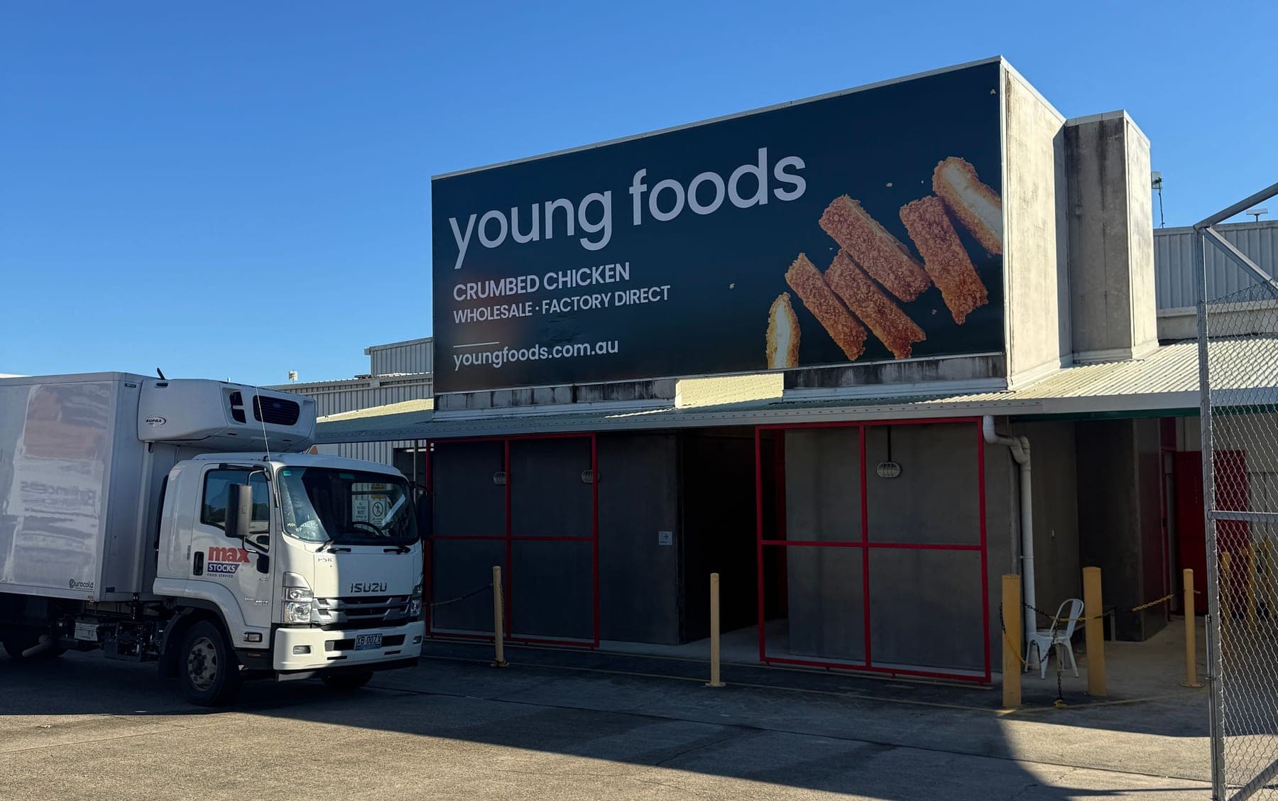 The Young Foods building at Kunda Park, with our signage and a refrigerated truck out front